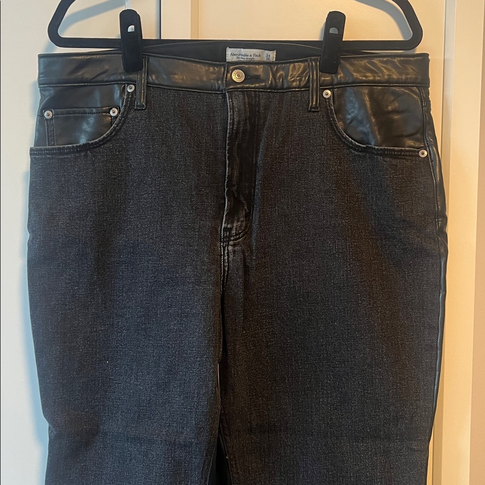 Abercrombie and Fitch black denim and leather jeans. ￼